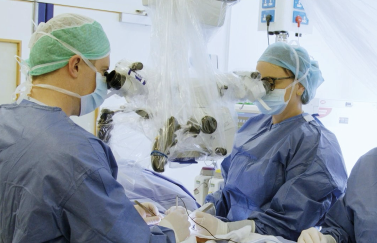 Mr Gordon using an operating microscope and micro-doppler in a complex varicocele case